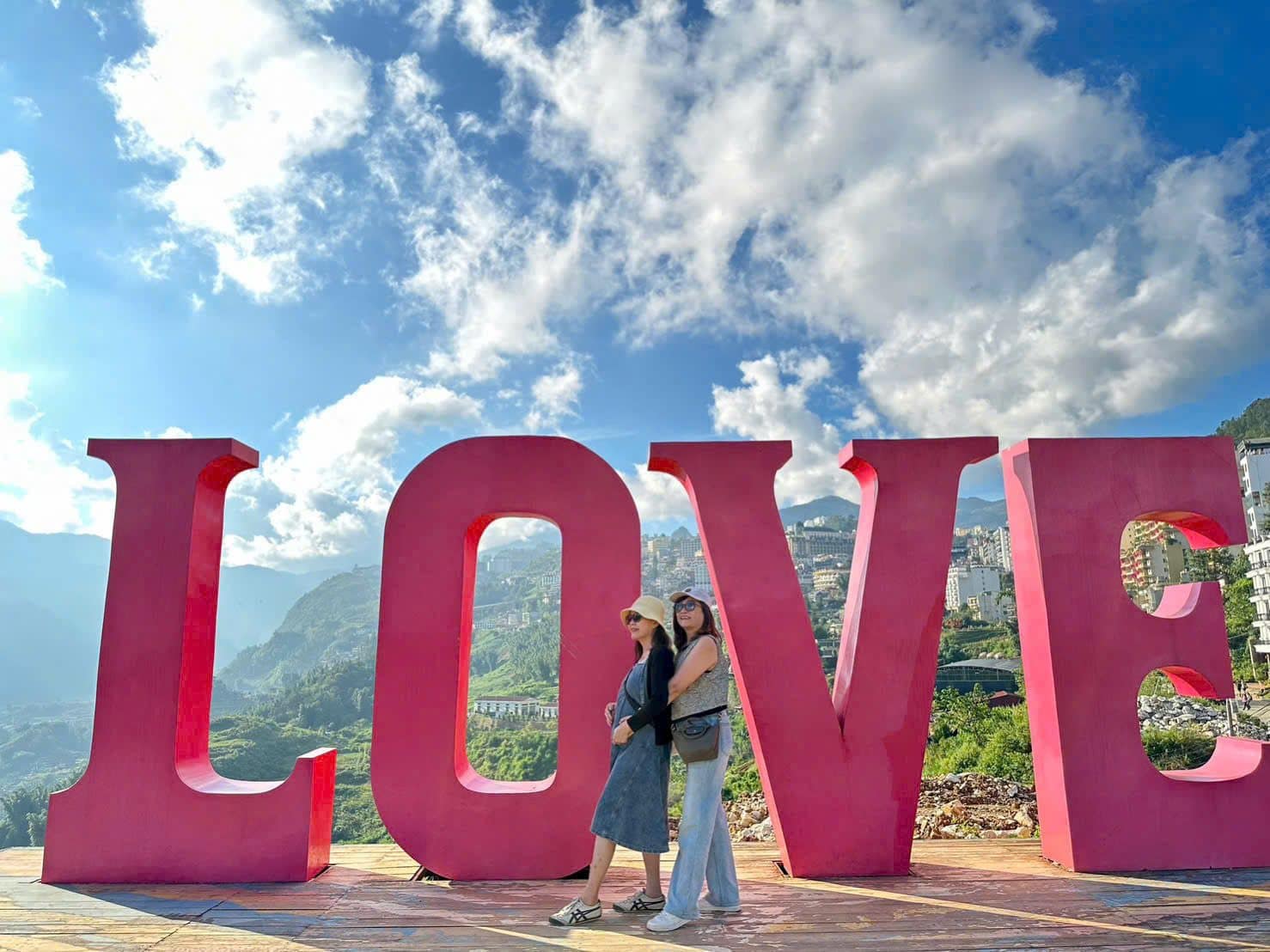 Travellers at the oversized LOVE letters on the mountain top at Ba Na Hills