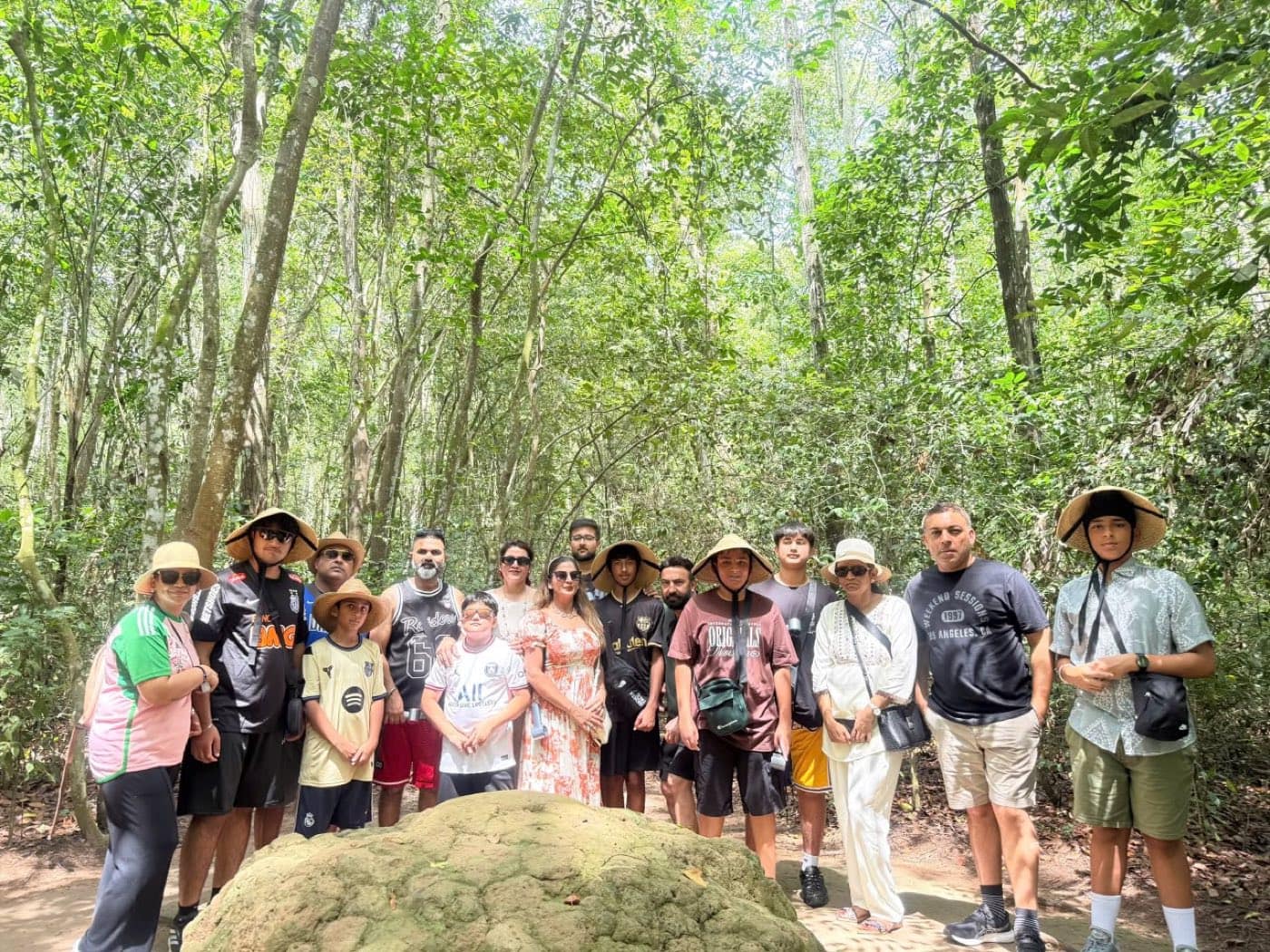 The group gathered around a termite-mound air vent in the forest above the tunnels