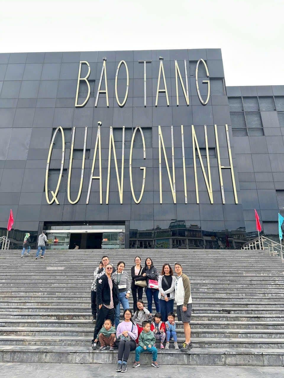 A group on the steps of the Quang Ninh Museum before the bay