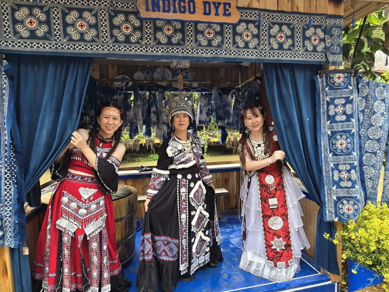 Three guests in borrowed highland dress at an indigo dye workshop