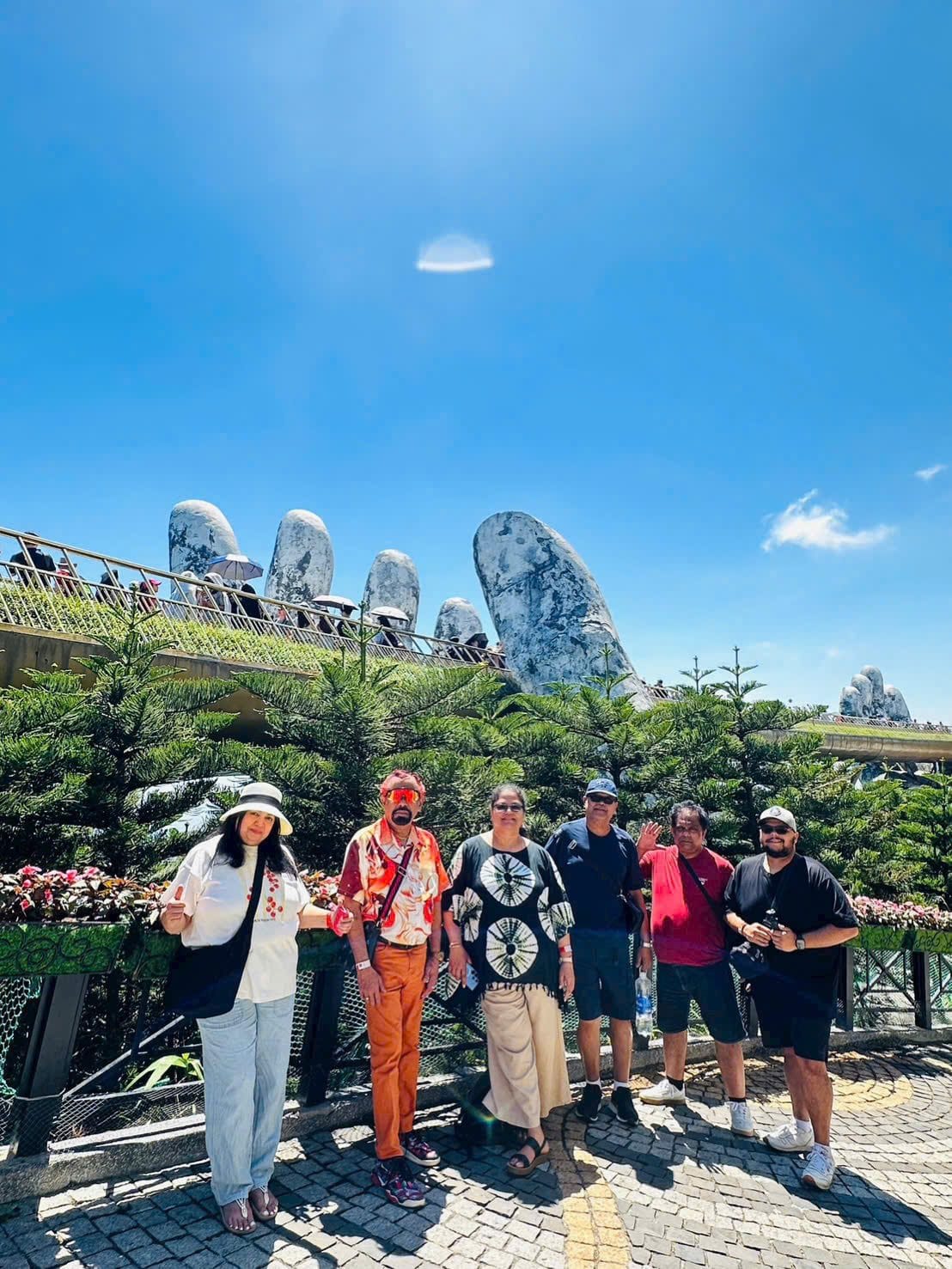 A group spread along the Golden Bridge on a clear morning