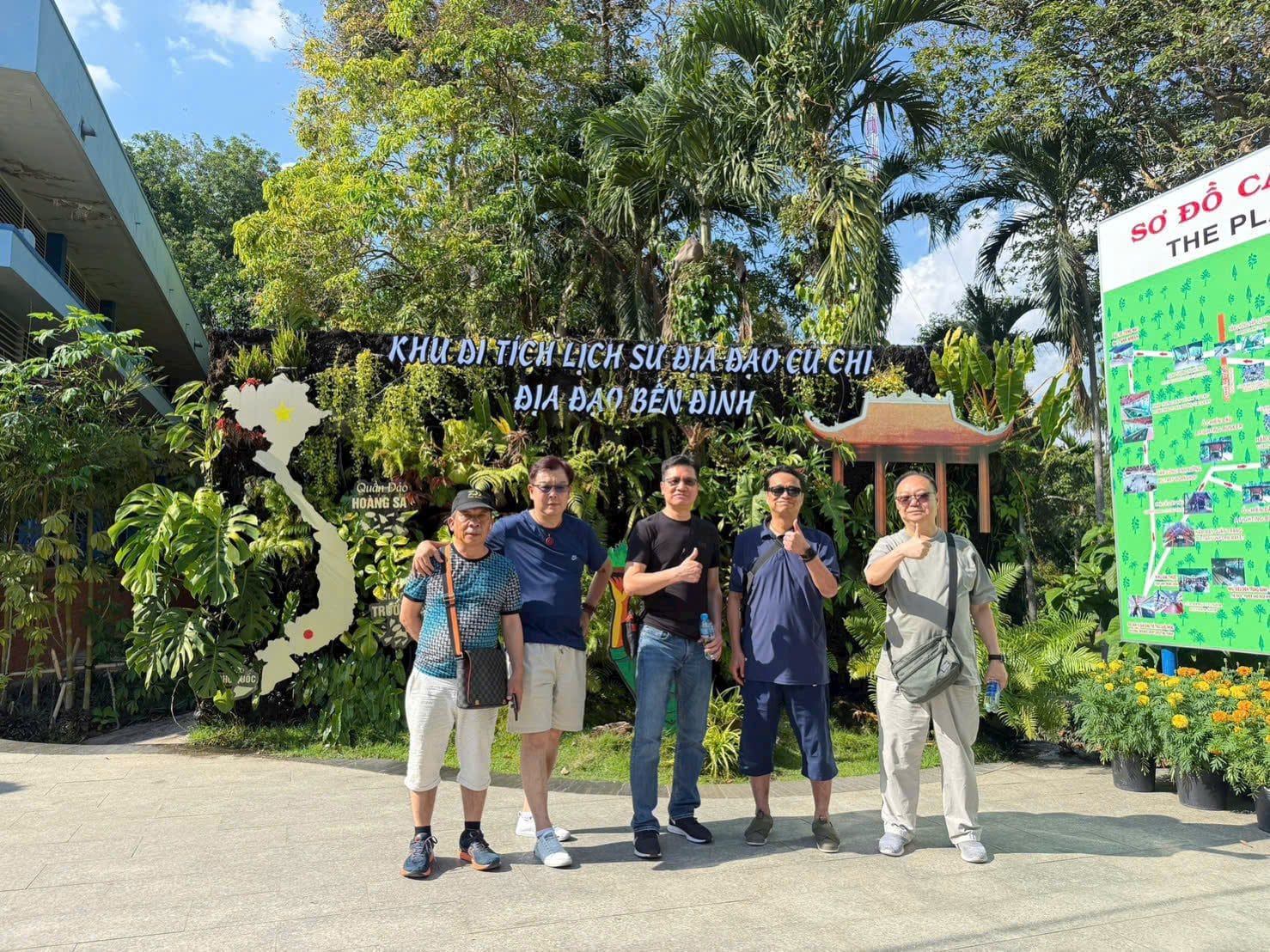 Guests at the entrance board of the Cu Chi tunnel historic site