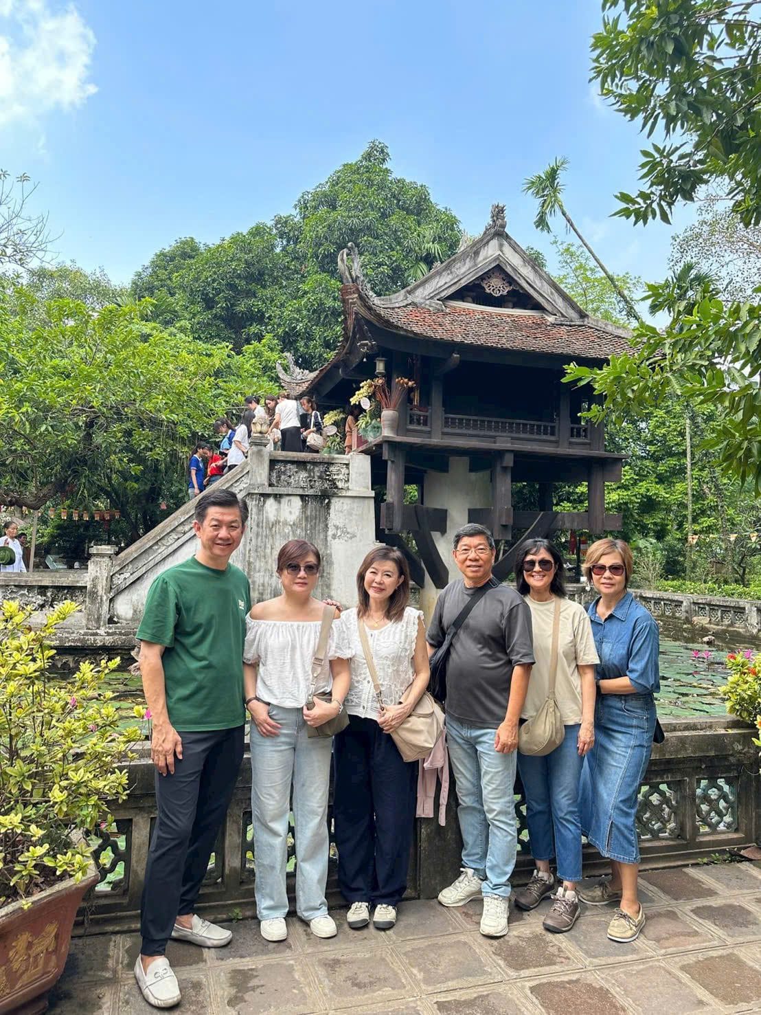 A group at the gate of the Temple of Literature, Vietnam's first university